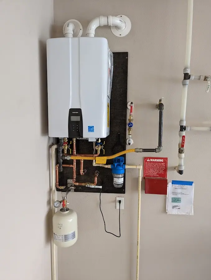 Professional plumber installing copper piping in a Guyton home